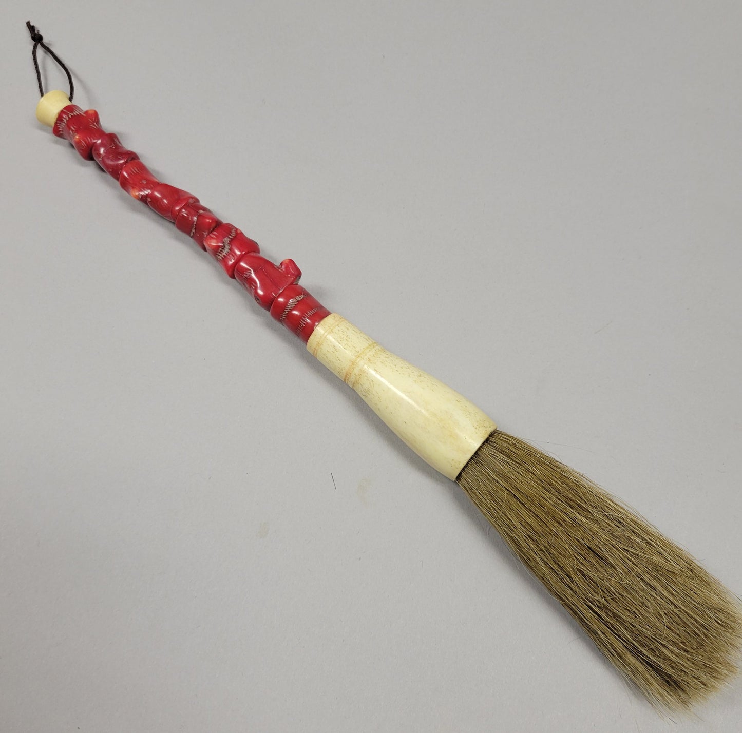 Chinese Calligraphy Brush With Carved Red Coral Handle and Bone Ferrule, Circa 1920–1950