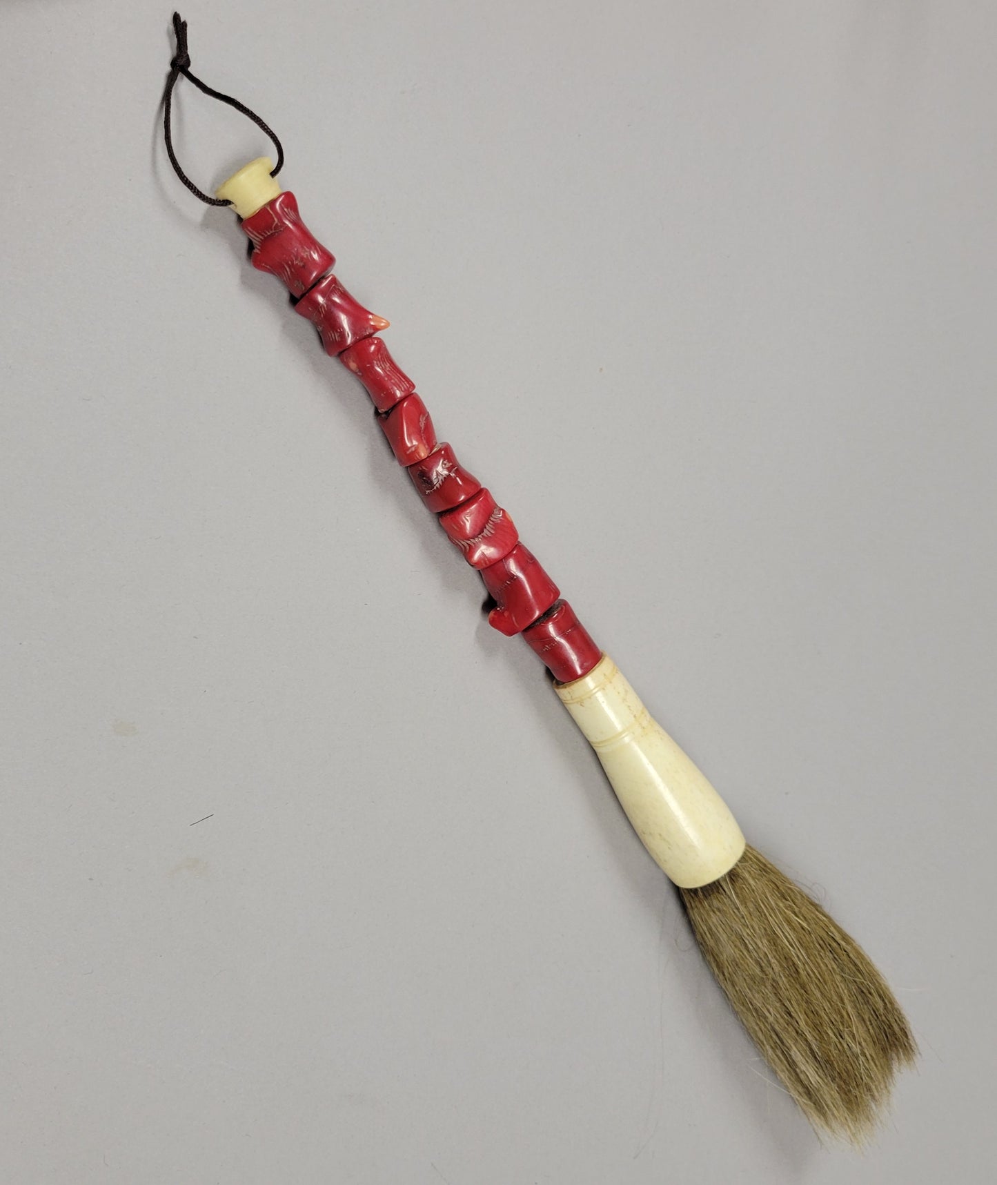 Chinese Calligraphy Brush With Carved Red Coral Handle and Bone Ferrule, Circa 1920–1950