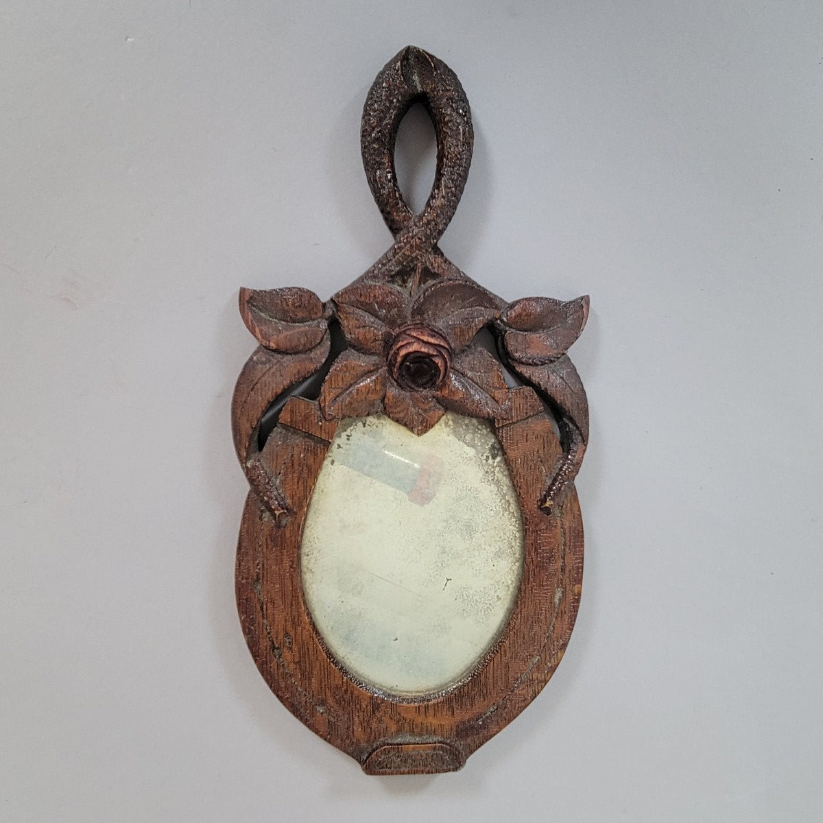 Late 19th Century American Folk Art Horseshoe Wall Mirror with Carved Dove