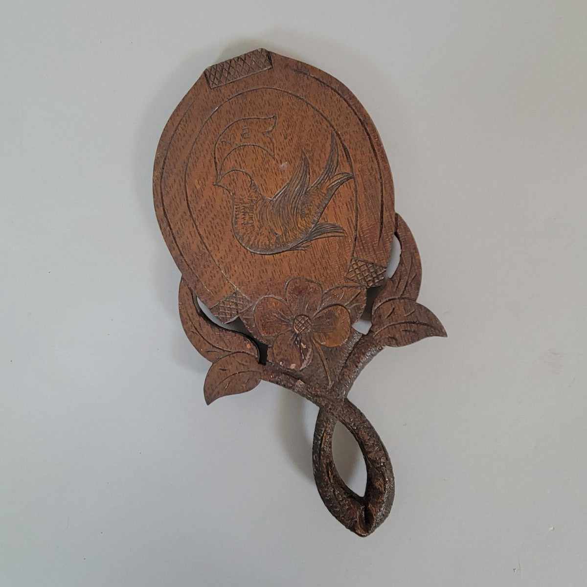 Late 19th Century American Folk Art Horseshoe Wall Mirror with Carved Dove